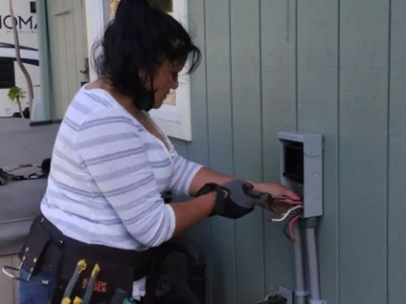 Licensed electrician wiring an exterior subpanel in Hannibal